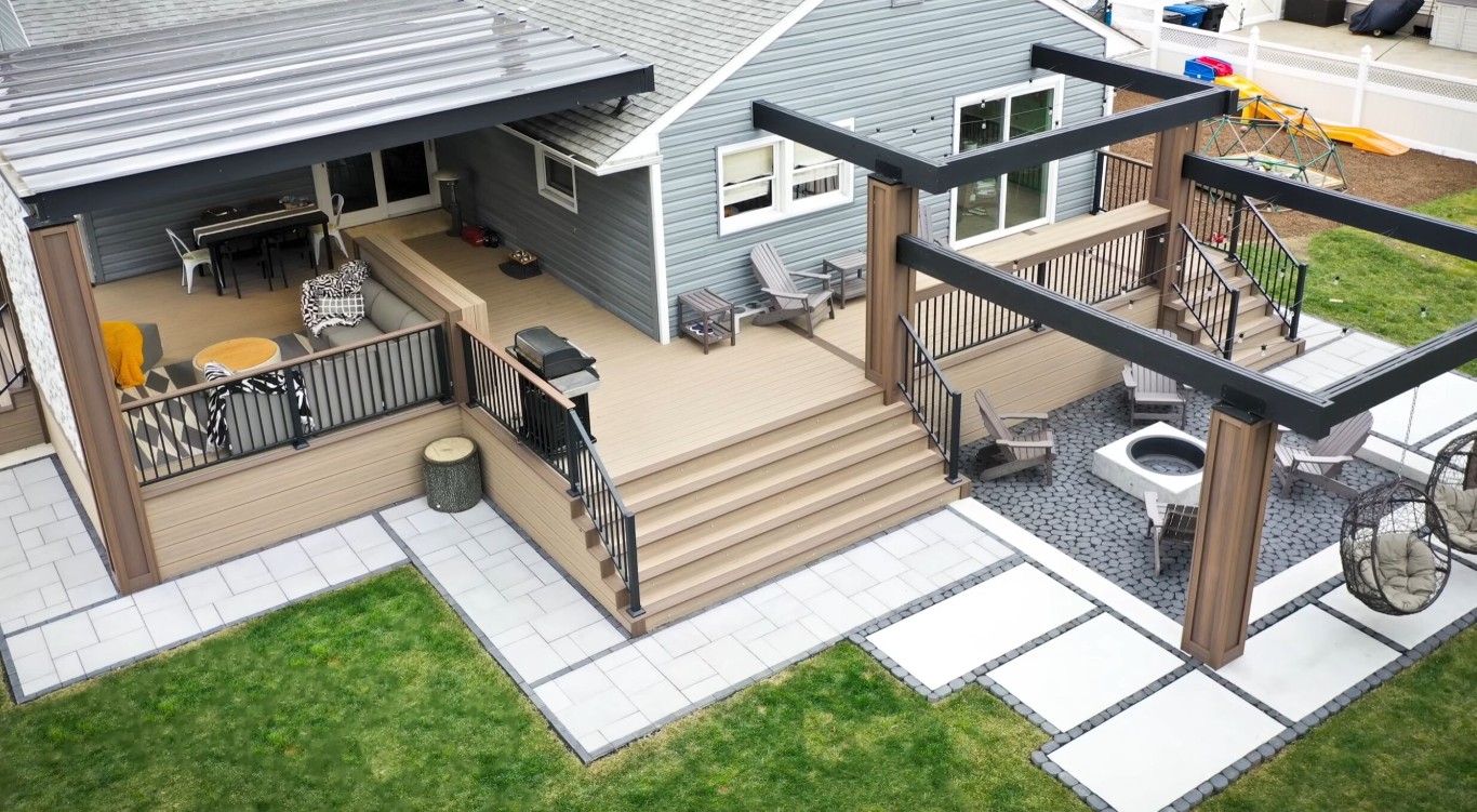 Multi-level deck with designated zones for dining and lounging in Schenectady, NY